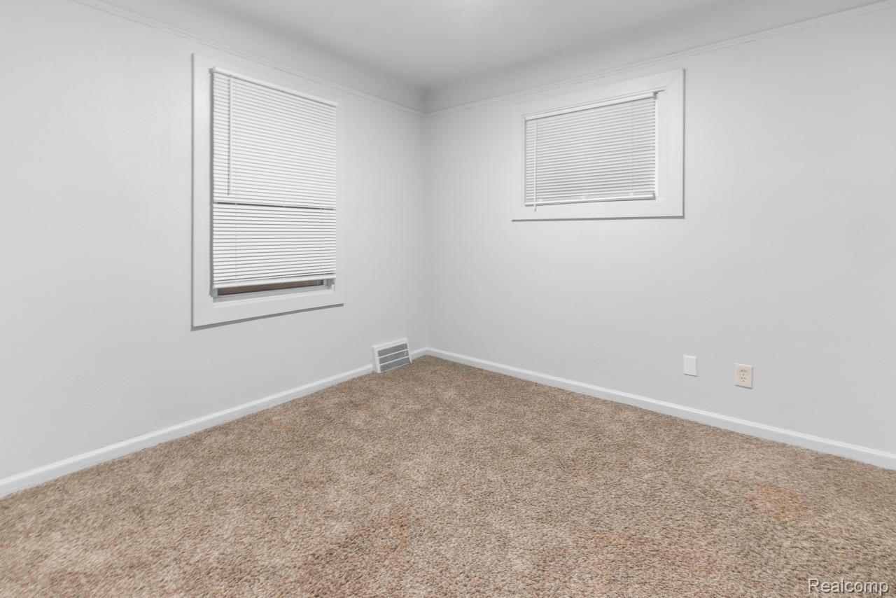 12651-12655 Kelly Road Detroit, MI 48224 - Photo 14 of 21 Spare room featuring baseboards and carpet flooring