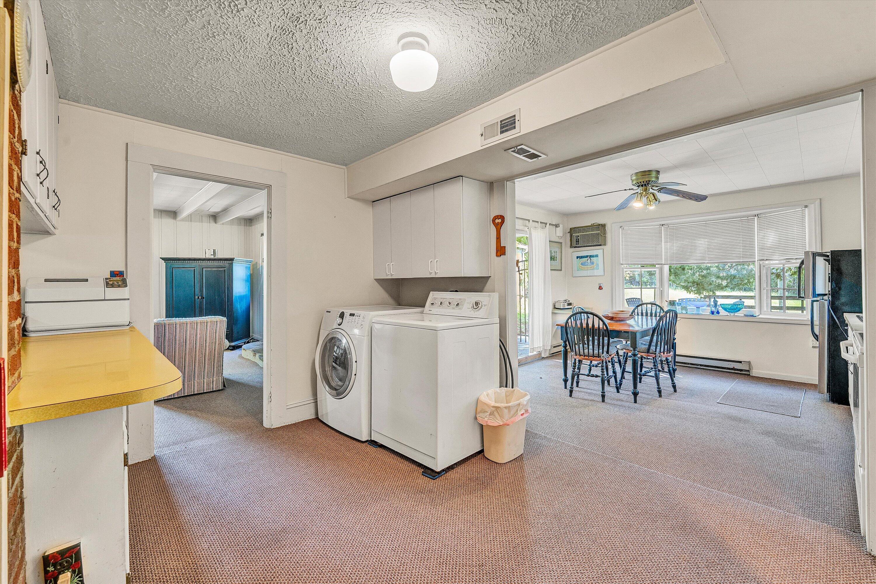 5328 White House Road Moneta, VA 24121 - Photo 9 of 39 a room with furniture a washer and dryer