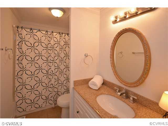 13810 Sutters Mill Road Midlothian, VA 23112 - Photo 6 of 12 a bathroom with a sink mirror and toilet