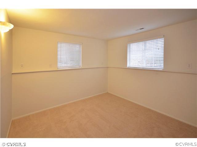 13810 Sutters Mill Road Midlothian, VA 23112 - Photo 8 of 12 a view of an empty room with a window