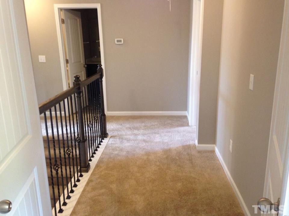 2712 Shepherd Valley Street Raleigh, NC 27610 - Photo 12 of 21 a view of a hallway with a door