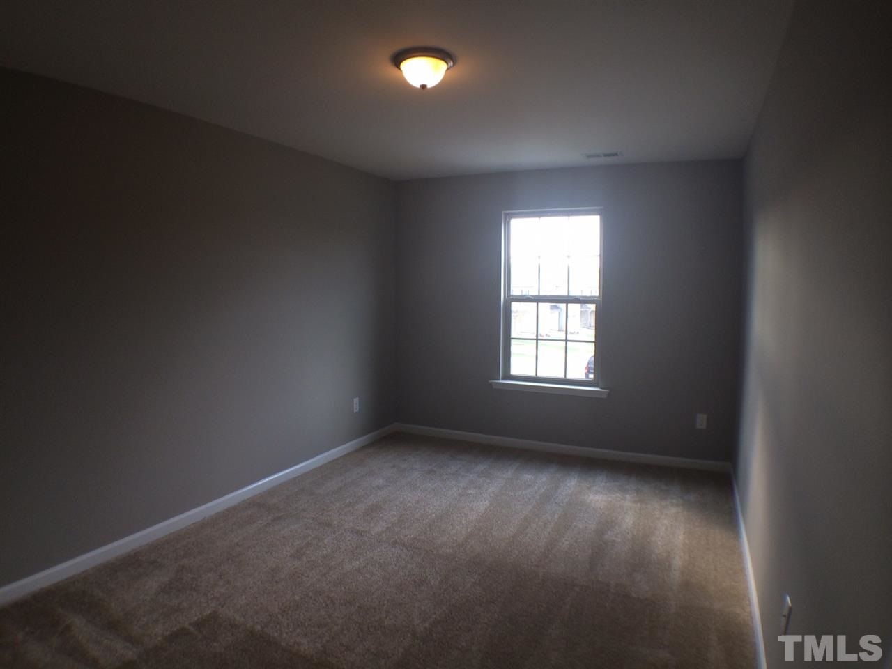 2712 Shepherd Valley Street Raleigh, NC 27610 - Photo 15 of 21 an empty room with a window