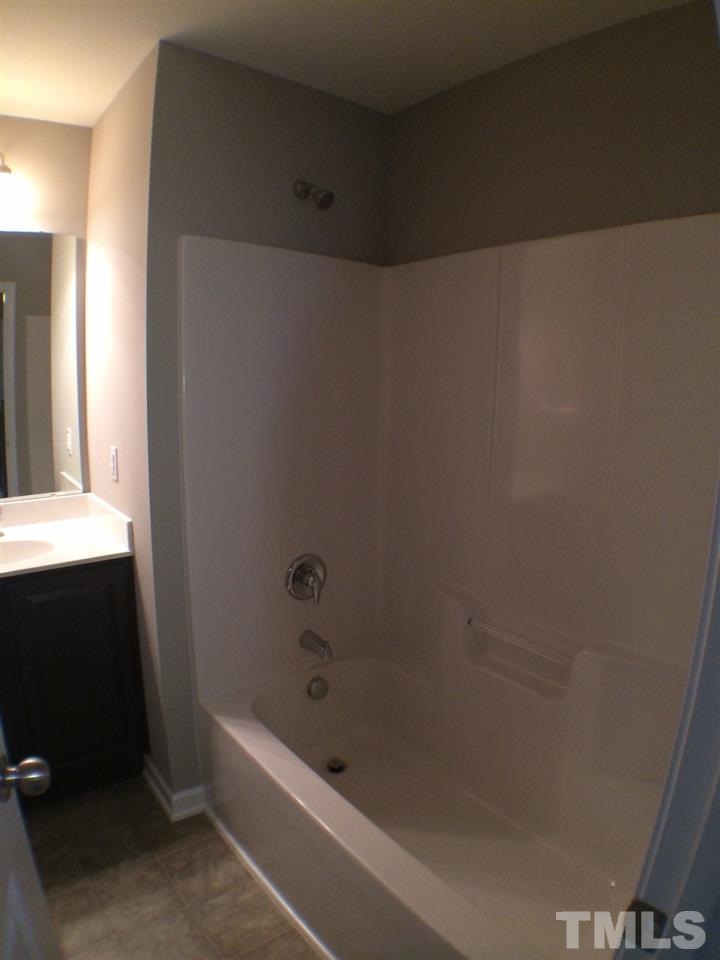 2712 Shepherd Valley Street Raleigh, NC 27610 - Photo 18 of 21 a bathroom with a bathtub