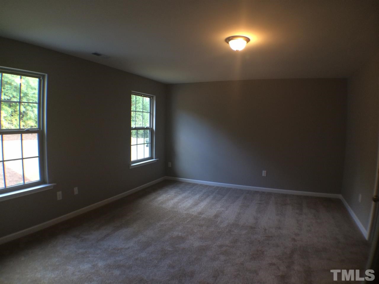 2712 Shepherd Valley Street Raleigh, NC 27610 - Photo 19 of 21 an empty room with windows