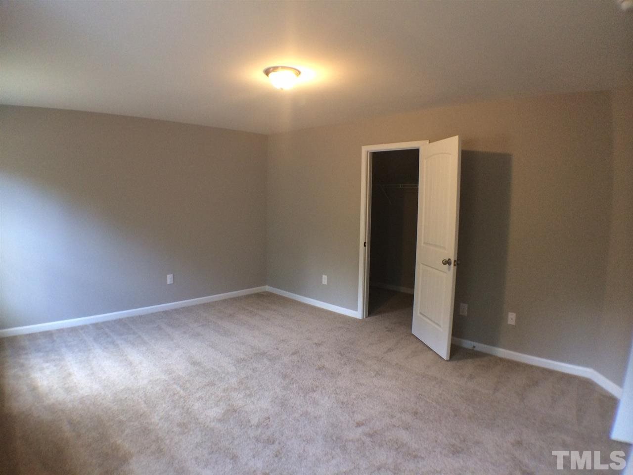 2712 Shepherd Valley Street Raleigh, NC 27610 - Photo 20 of 21 an empty room with an entryway