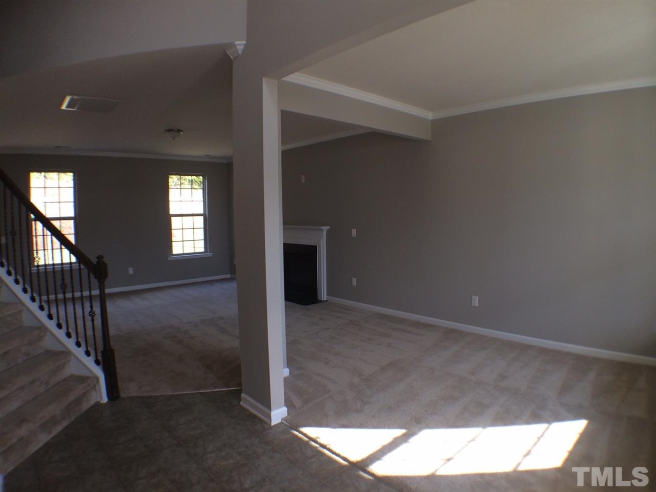 2712 Shepherd Valley Street Raleigh, NC 27610 - Photo 3 of 21 a view of an empty room with wooden floor and a window