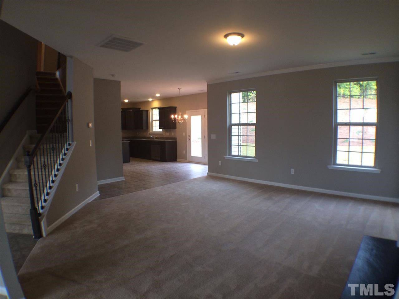 2712 Shepherd Valley Street Raleigh, NC 27610 - Photo 4 of 21 an empty room with windows and fireplace