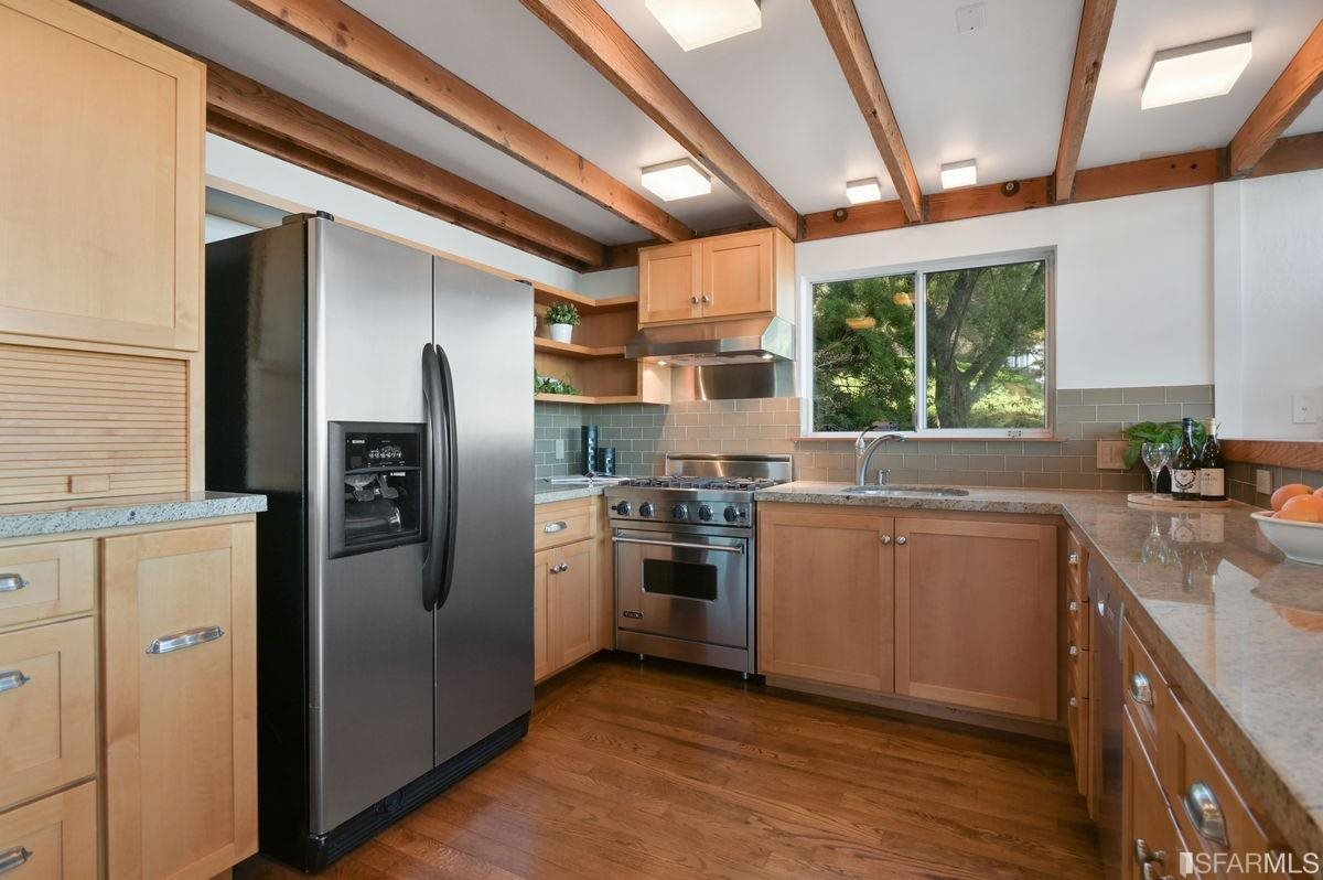 1502 Shotwell Street San Francisco, CA 94110 - Photo 19 of 61 a kitchen with a sink stainless steel appliances and window