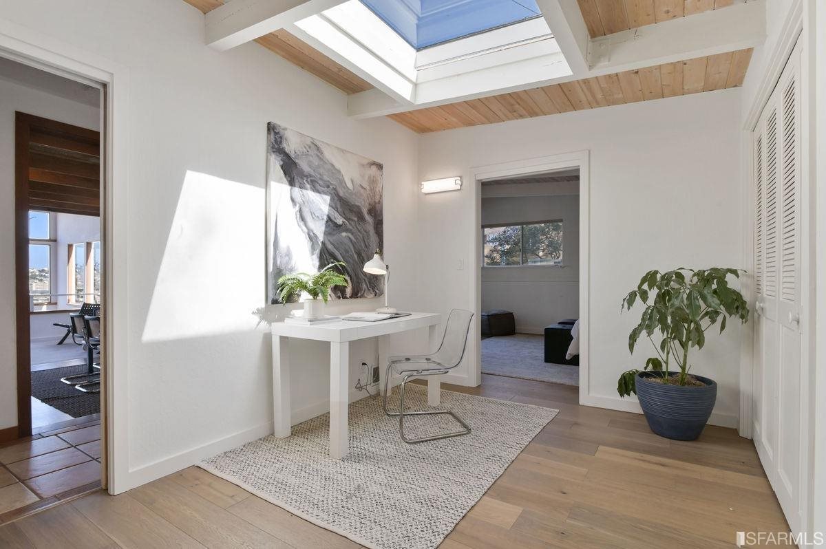 1502 Shotwell Street San Francisco, CA 94110 - Photo 23 of 61 a living room with furniture and a potted plant