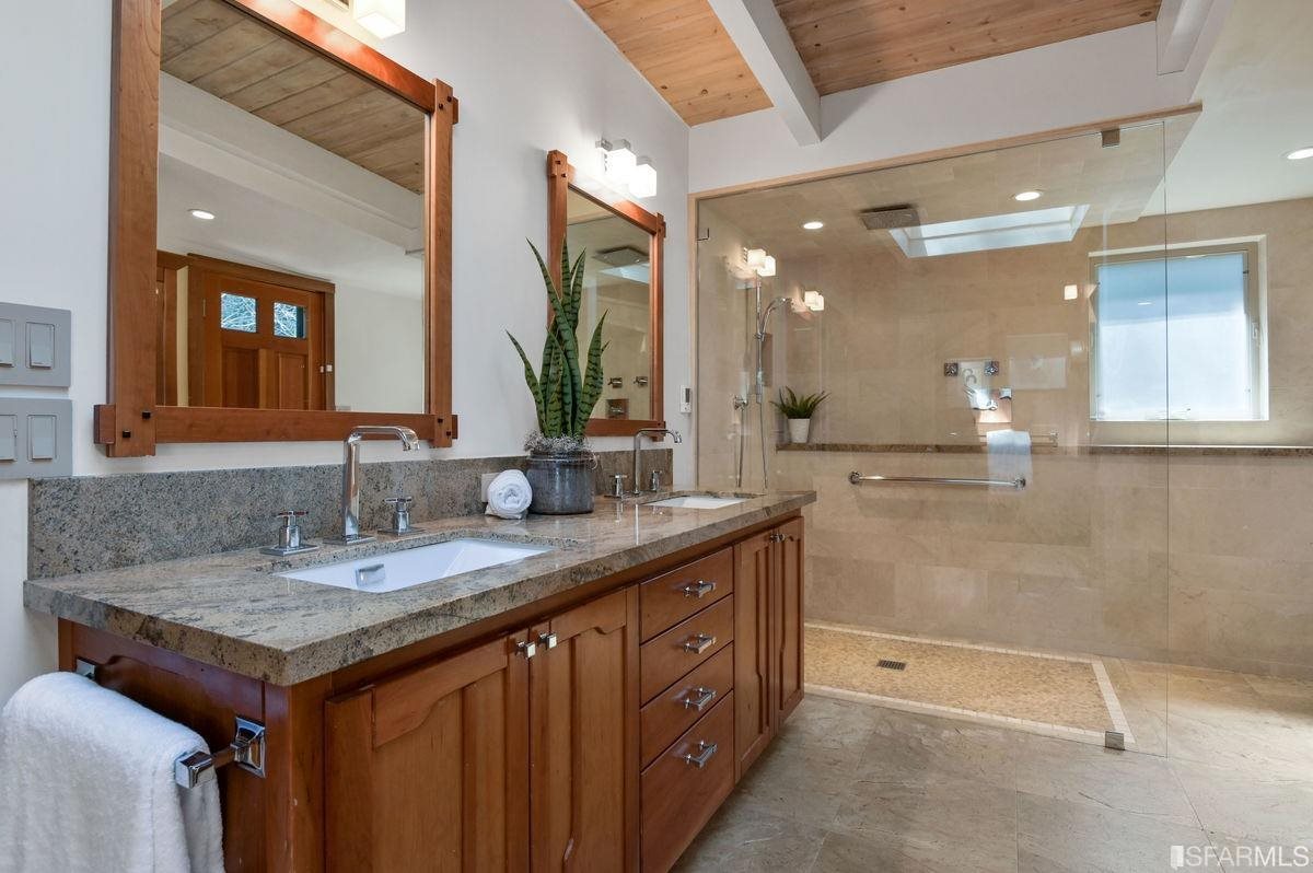 1502 Shotwell Street San Francisco, CA 94110 - Photo 24 of 61 a bathroom with a granite countertop sink and a mirror