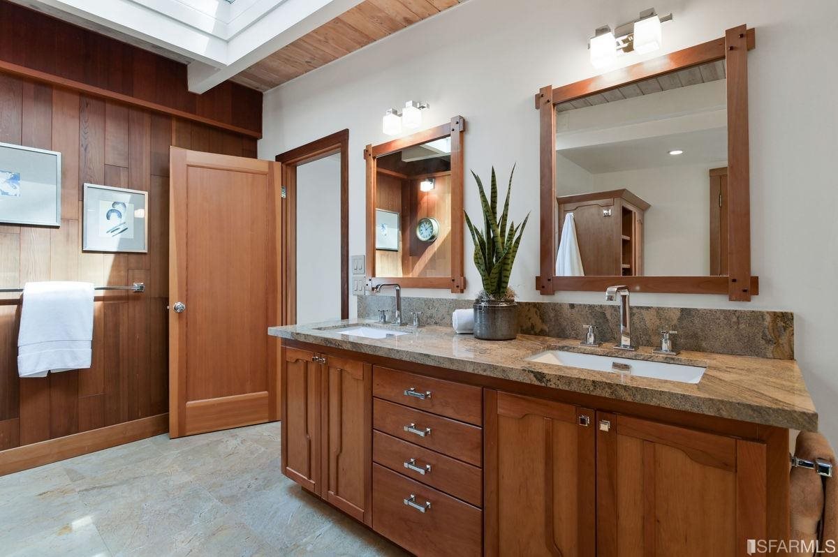 1502 Shotwell Street San Francisco, CA 94110 - Photo 25 of 61 a bathroom with a double vanity sink and a mirror