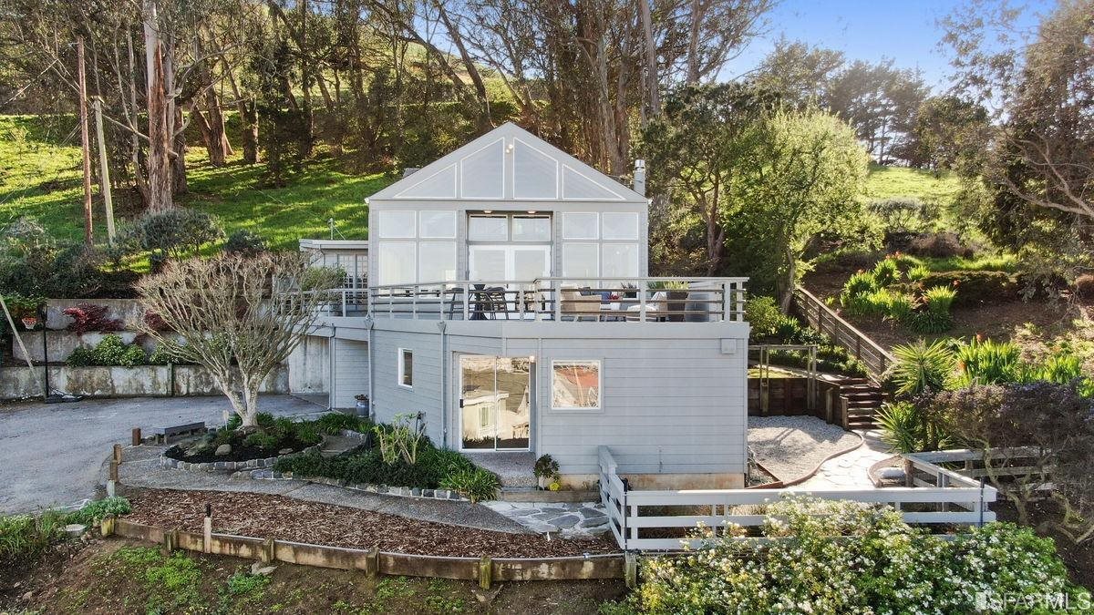1502 Shotwell Street San Francisco, CA 94110 - Photo 3 of 61 a view of a house with a yard and large trees