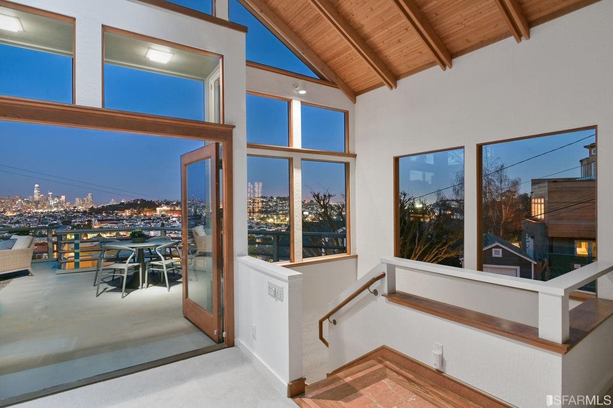 1502 Shotwell Street San Francisco, CA 94110 - Photo 32 of 61 a view of a hallway with dining area and chandelier