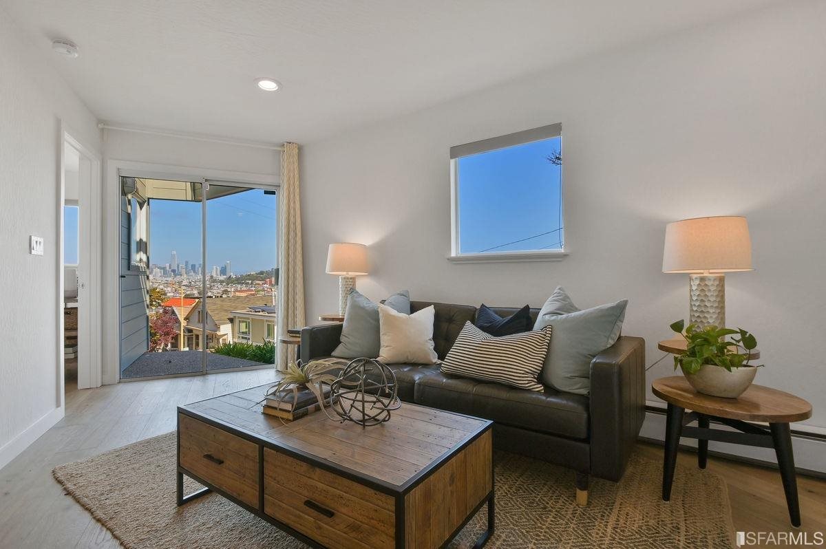 1502 Shotwell Street San Francisco, CA 94110 - Photo 33 of 61 a living room with furniture and a wooden floor