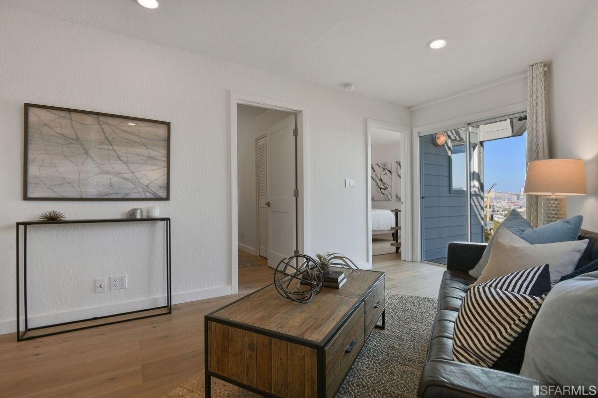 1502 Shotwell Street San Francisco, CA 94110 - Photo 35 of 61 a living room with furniture and wooden floor