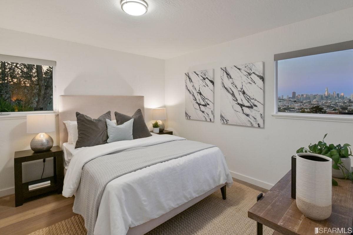 1502 Shotwell Street San Francisco, CA 94110 - Photo 36 of 61 a bedroom with bed and painting on the wall