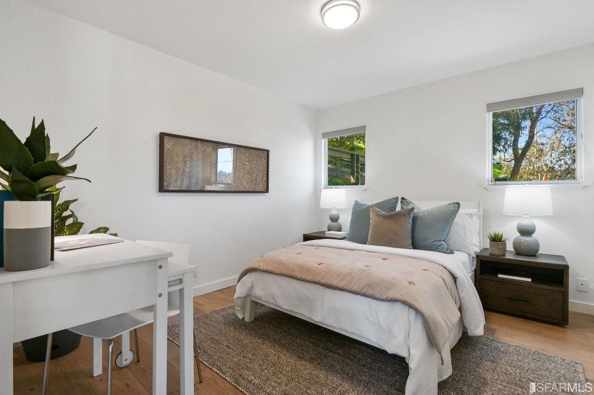 1502 Shotwell Street San Francisco, CA 94110 - Photo 38 of 61 a bedroom with bed and a potted plant