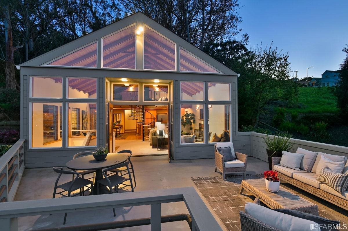 1502 Shotwell Street San Francisco, CA 94110 - Photo 44 of 61 a patio with couches table and chairs and potted plants