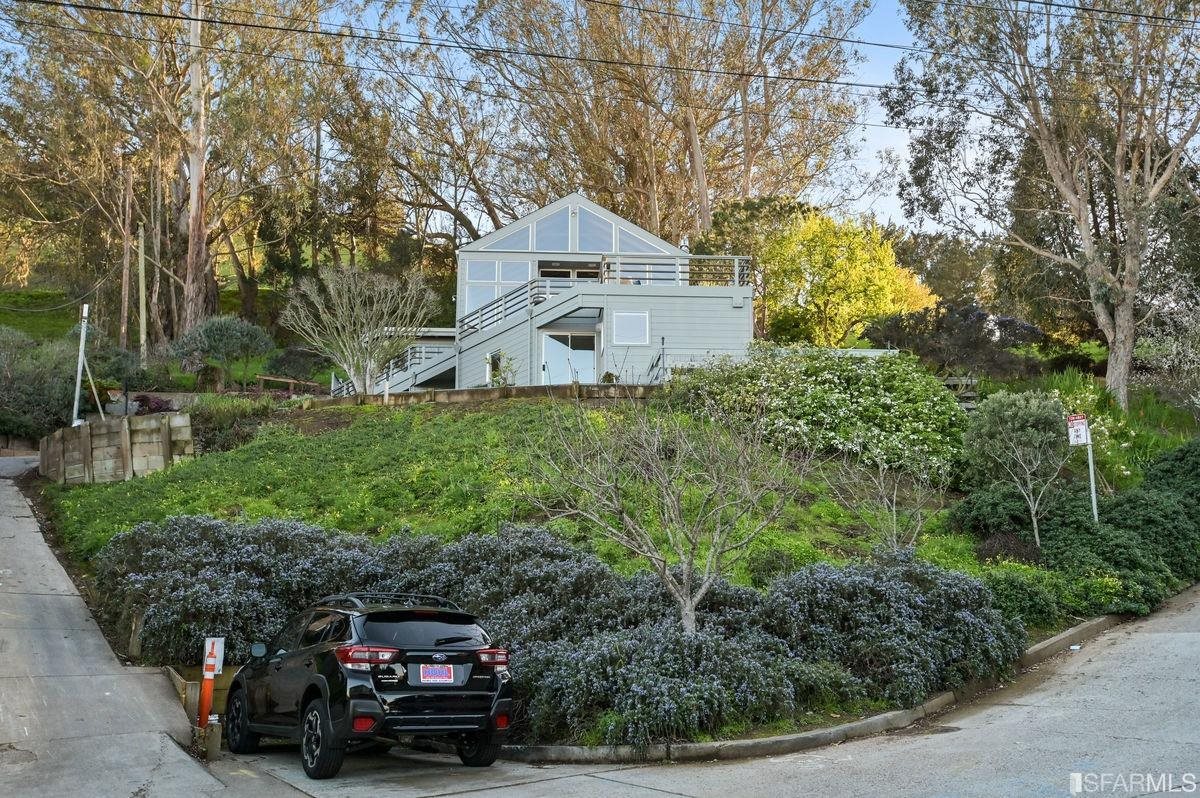 1502 Shotwell Street San Francisco, CA 94110 - Photo 55 of 61 a car parked in front of a white house