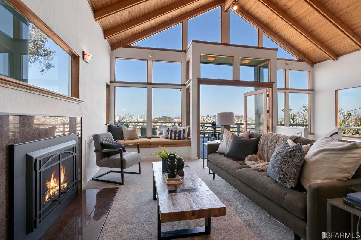 1502 Shotwell Street San Francisco, CA 94110 - Photo 8 of 61 a living room with furniture fireplace and a large window