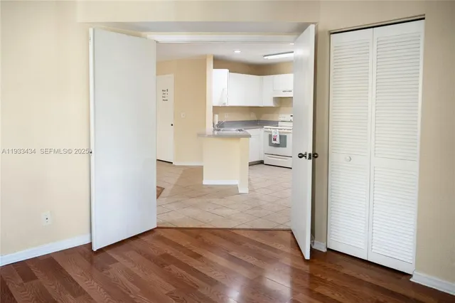 a view of a kitchen with wooden floor