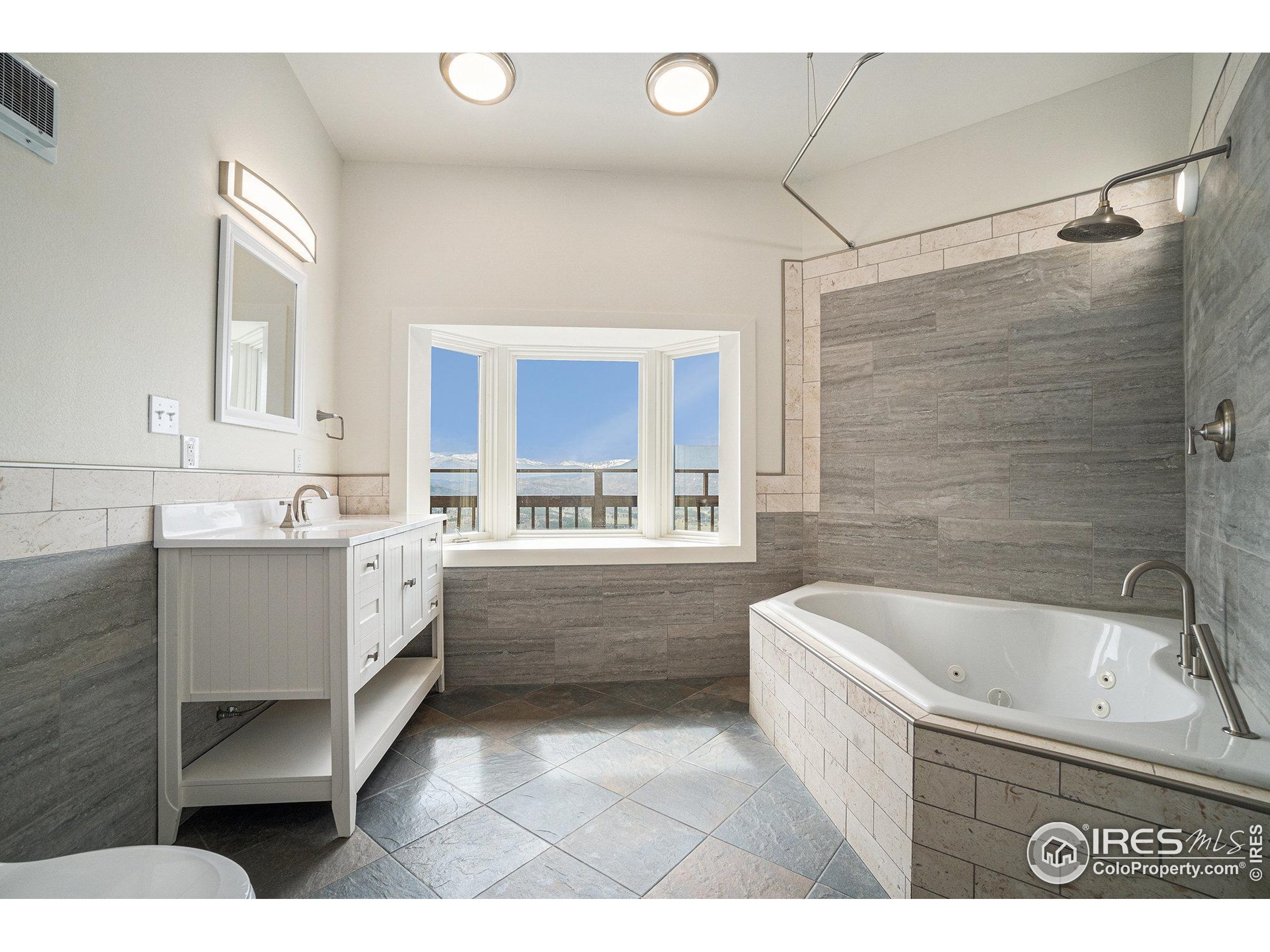 552 Blue Grouse Lane Bellvue, CO 80512 - Photo 15 of 39 a bathroom with a bathtub sink and mirror