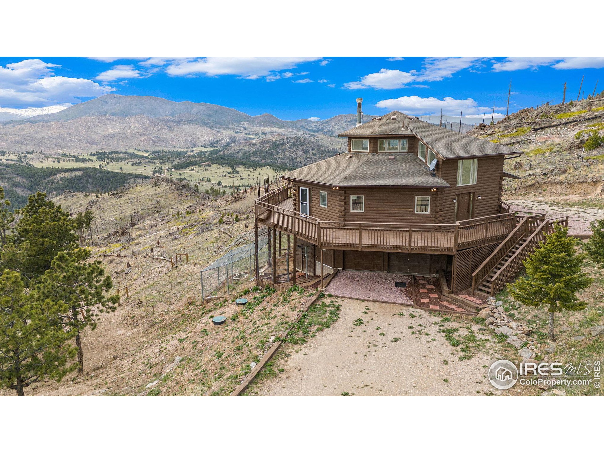 552 Blue Grouse Lane Bellvue, CO 80512 - Photo 2 of 39 a view of a terrace with a lake view