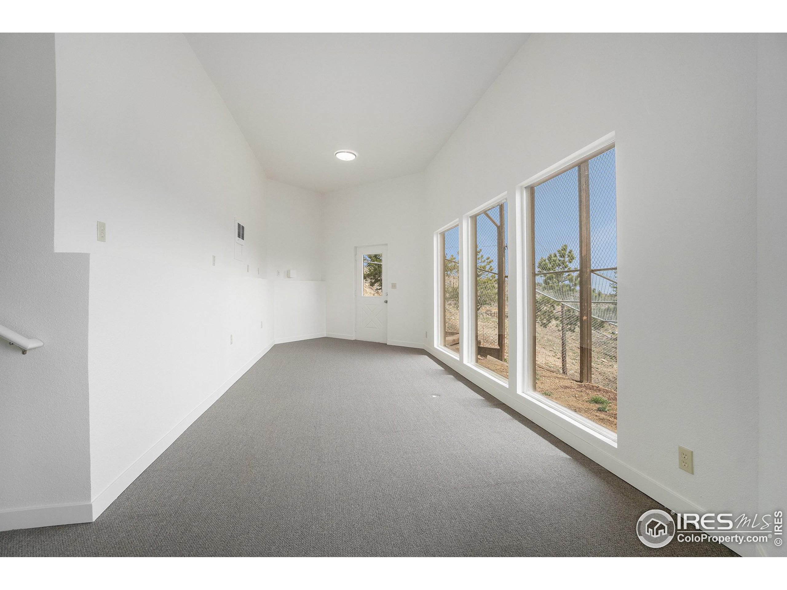 552 Blue Grouse Lane Bellvue, CO 80512 - Photo 24 of 39 a view of an empty room with a window