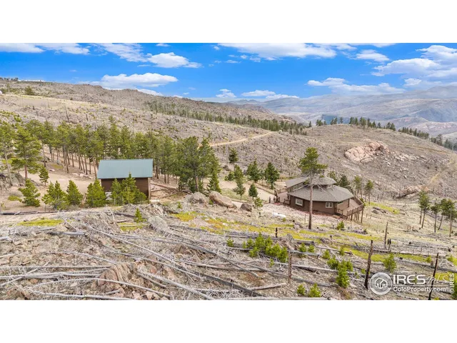 a view of a city with mountains in the background