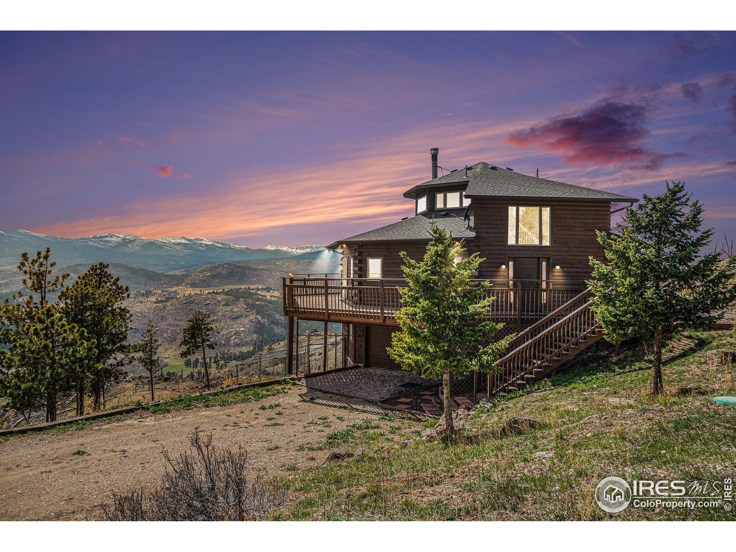 552 Blue Grouse Lane Bellvue, CO 80512 - Photo 4 of 39 a view of a house with a yard
