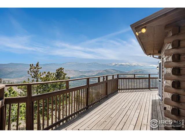 a view of balcony with wooden floor