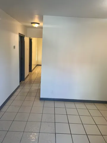 a view of an empty room and window