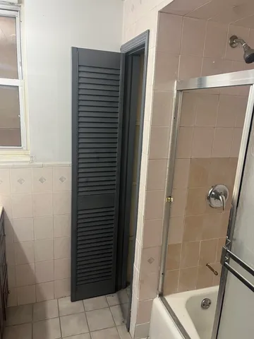 a bathroom with a bathtub and toilet