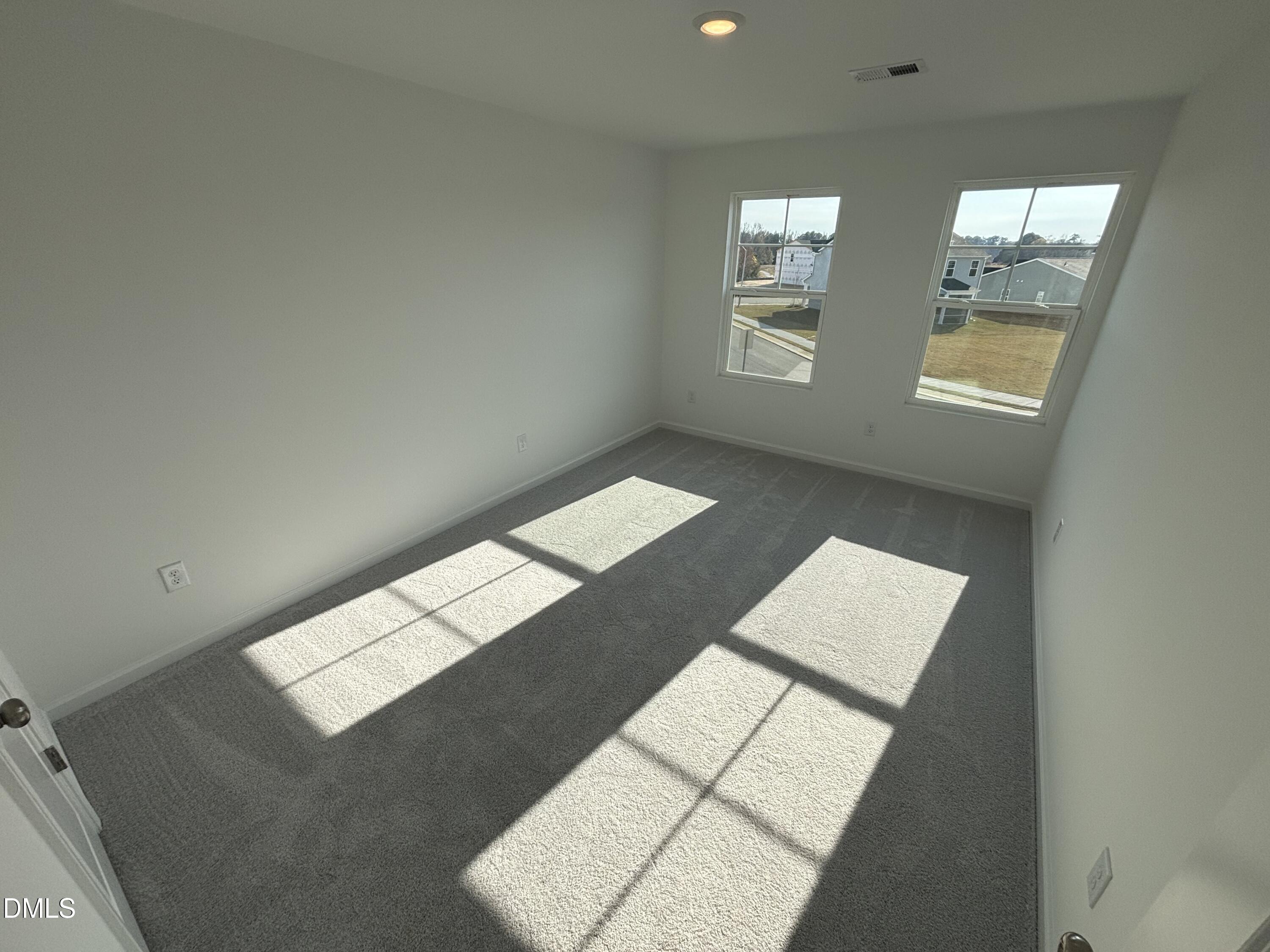 120 Blossom Fld Way Angier, NC 27501 - Photo 13 of 45 a view of an empty room with windows