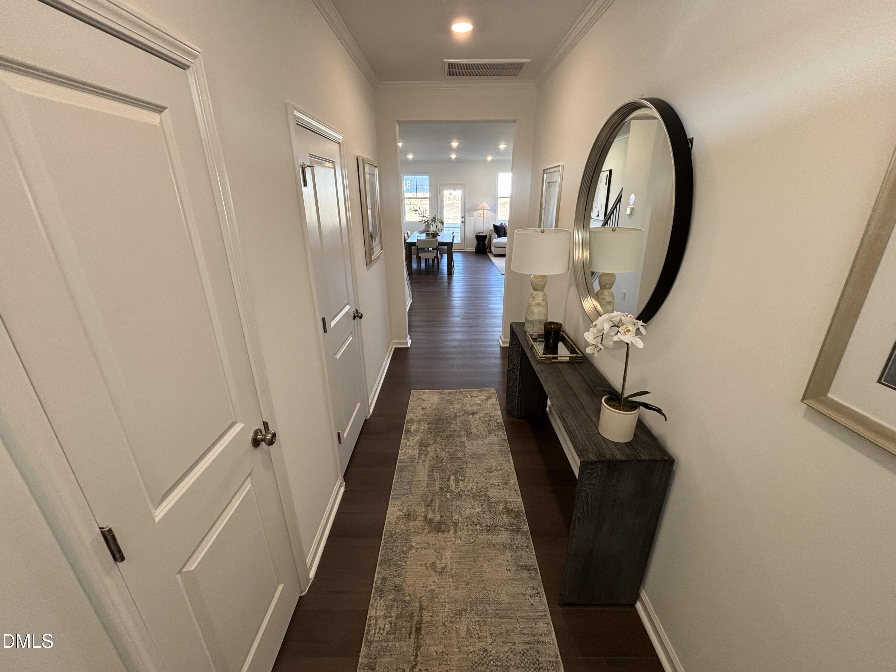 120 Blossom Fld Way Angier, NC 27501 - Photo 25 of 45 a view of a hallway with wooden floor and staircase