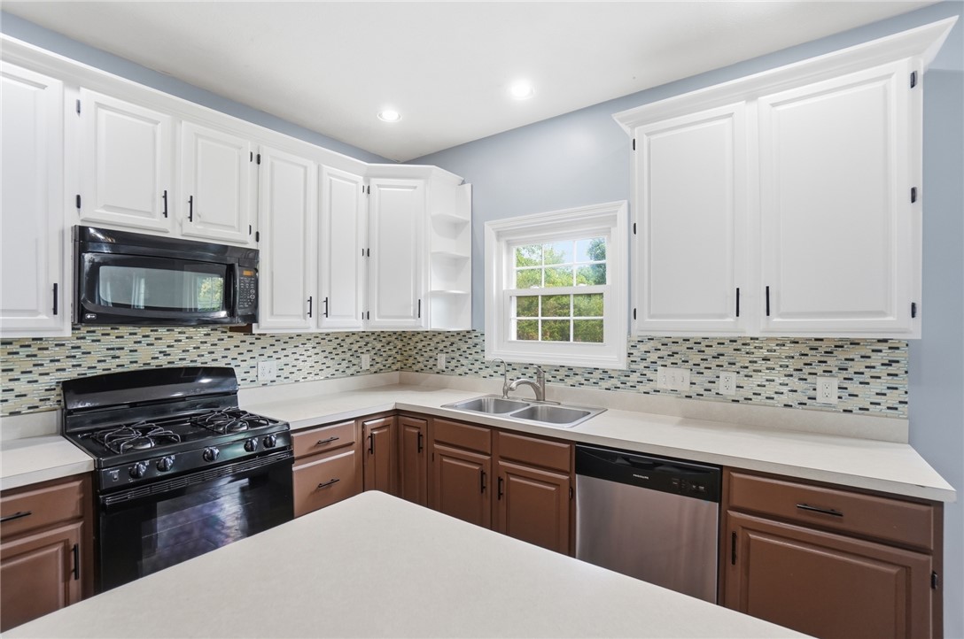 10 Chase Court Springboro, OH 45066 - Photo 21 of 75 This modern kitchen features crisp cabinetry, stylish countertops, and essential appliances for comfortable living.