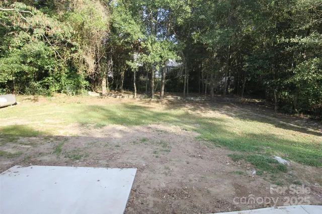 a view of a yard with of trees