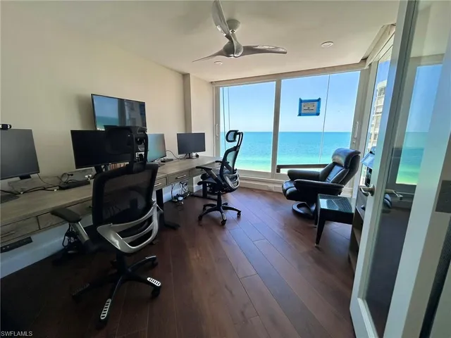 a view of a workspace with furniture and a workspace