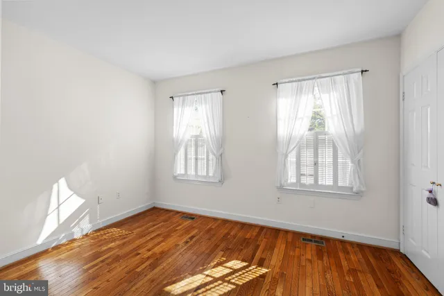 a view of walk in closet with clothes