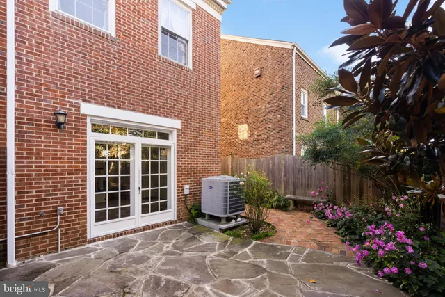 a view of a chair and table in backyard