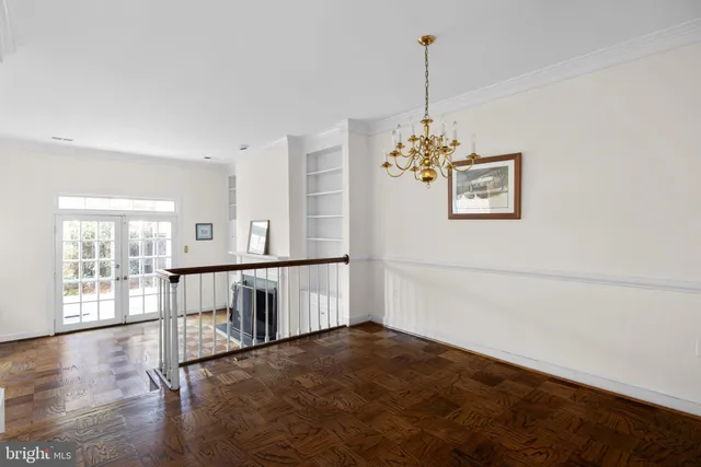 a view of a room with window and hardwood floor