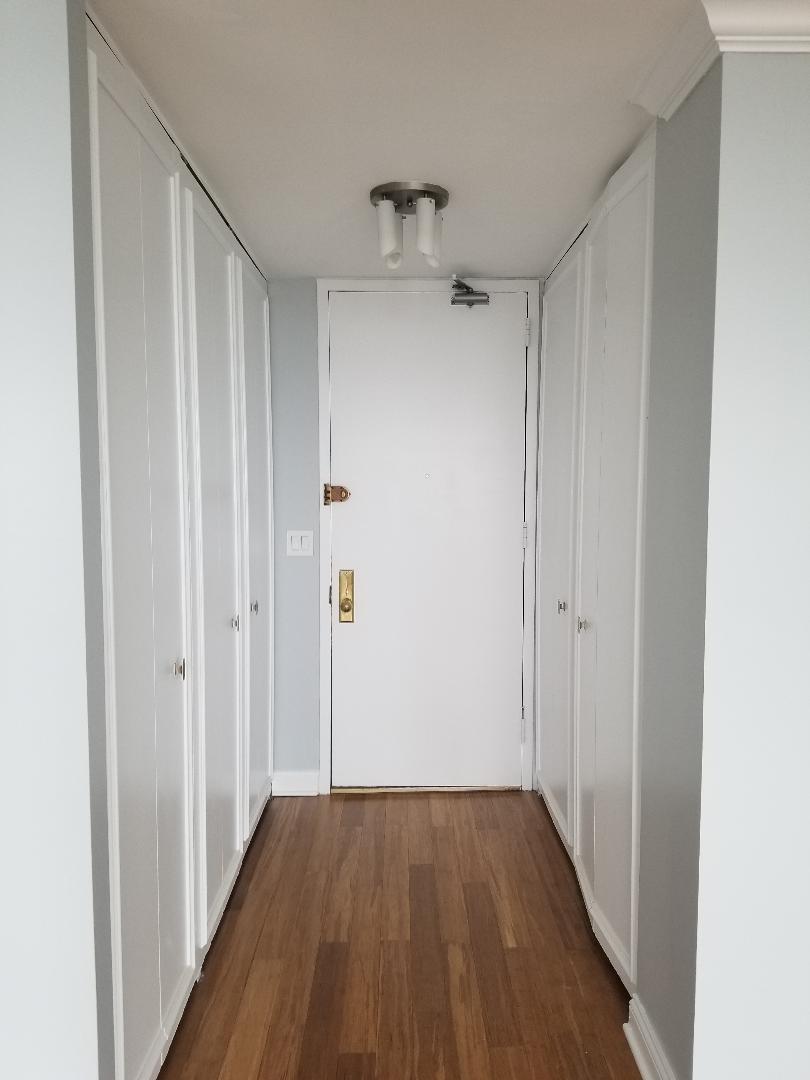 655 West Irving Park Road, Unit 5015 Chicago, IL 60613 - Photo 14 of 25 a view of a hallway with wooden floor