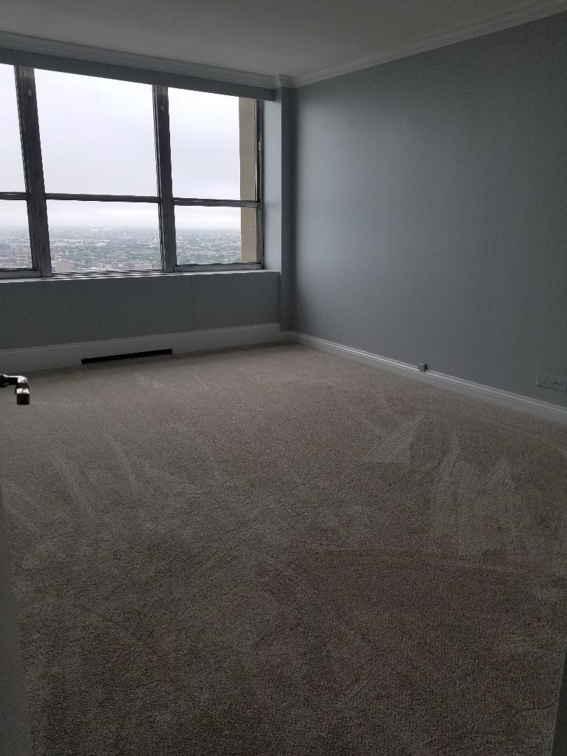 655 West Irving Park Road, Unit 5015 Chicago, IL 60613 - Photo 15 of 25 an empty room with a window
