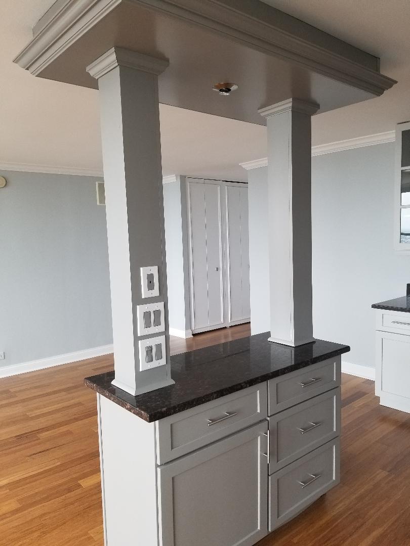 655 West Irving Park Road, Unit 5015 Chicago, IL 60613 - Photo 5 of 25 a kitchen with sink cabinets and wooden floor