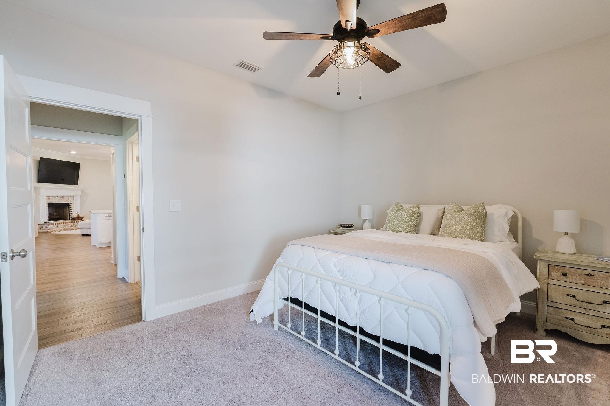 7872 Calverton Street Foley, AL 36535 - Photo 53 of 76 Carpeted room featuring a ceiling fan with integrated lighting, a white painted door frame, and light-colored walls