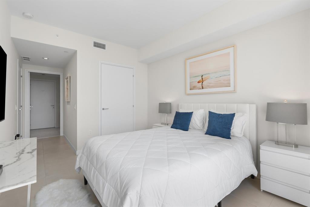 401 North Birch Road, Unit 1102 Fort Lauderdale, FL 33304 - Photo 11 of 31 a bedroom with a bed and a couch