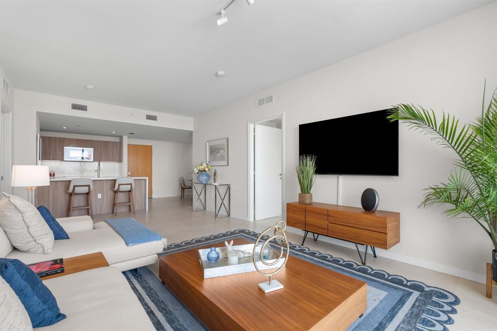 401 North Birch Road, Unit 1102 Fort Lauderdale, FL 33304 - Photo 13 of 31 a living room with furniture and a flat screen tv