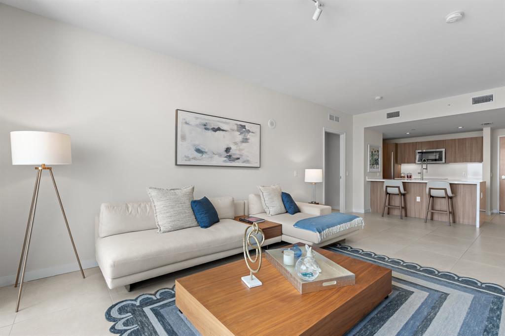 401 North Birch Road, Unit 1102 Fort Lauderdale, FL 33304 - Photo 14 of 31 a living room with furniture and a rug