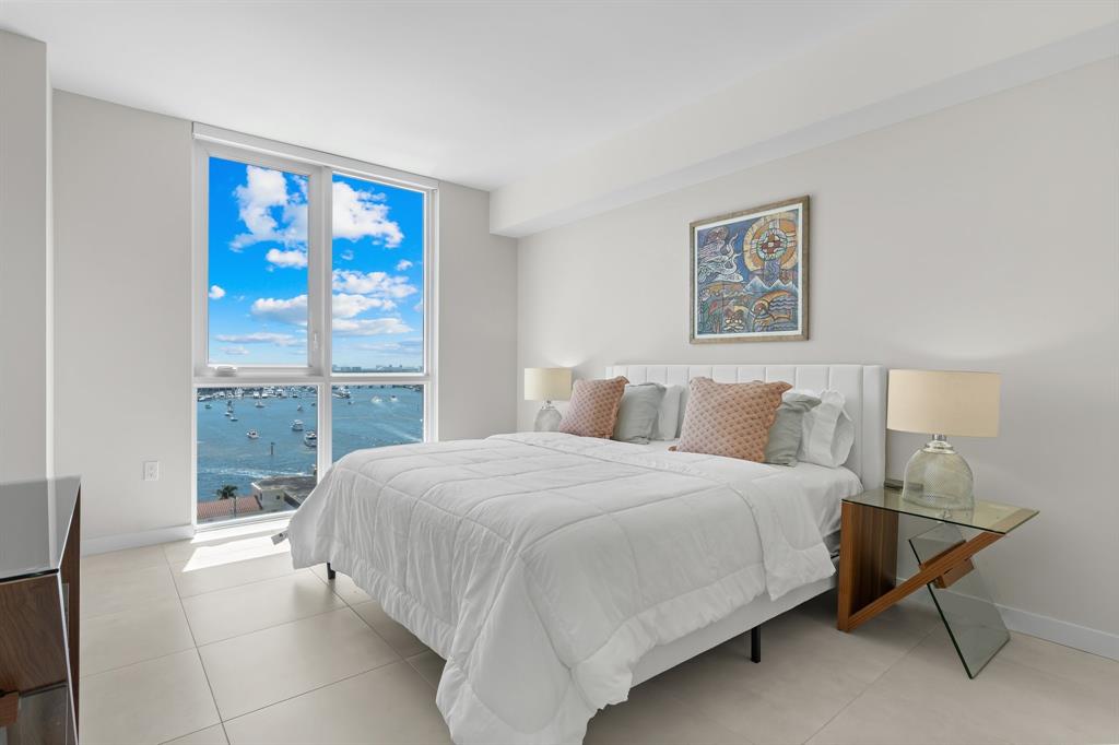 401 North Birch Road, Unit 1102 Fort Lauderdale, FL 33304 - Photo 16 of 31 a bedroom with a bed painting and a window