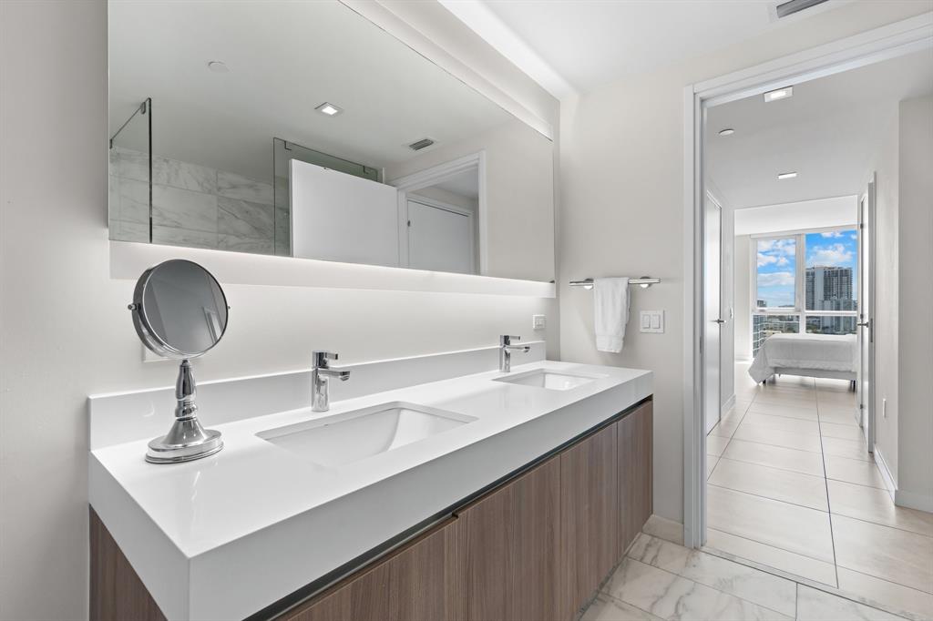 401 North Birch Road, Unit 1102 Fort Lauderdale, FL 33304 - Photo 21 of 31 a bathroom with a sink and a mirror